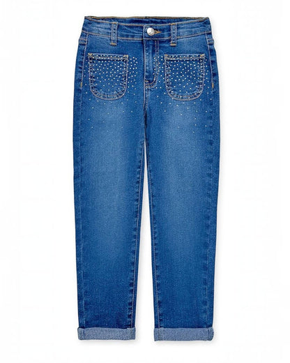 Blue jeans with studded details on a white background