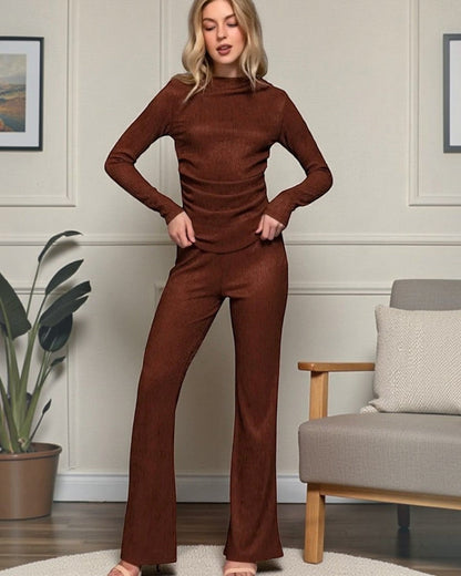 Woman wearing a brown outfit in a living room setting