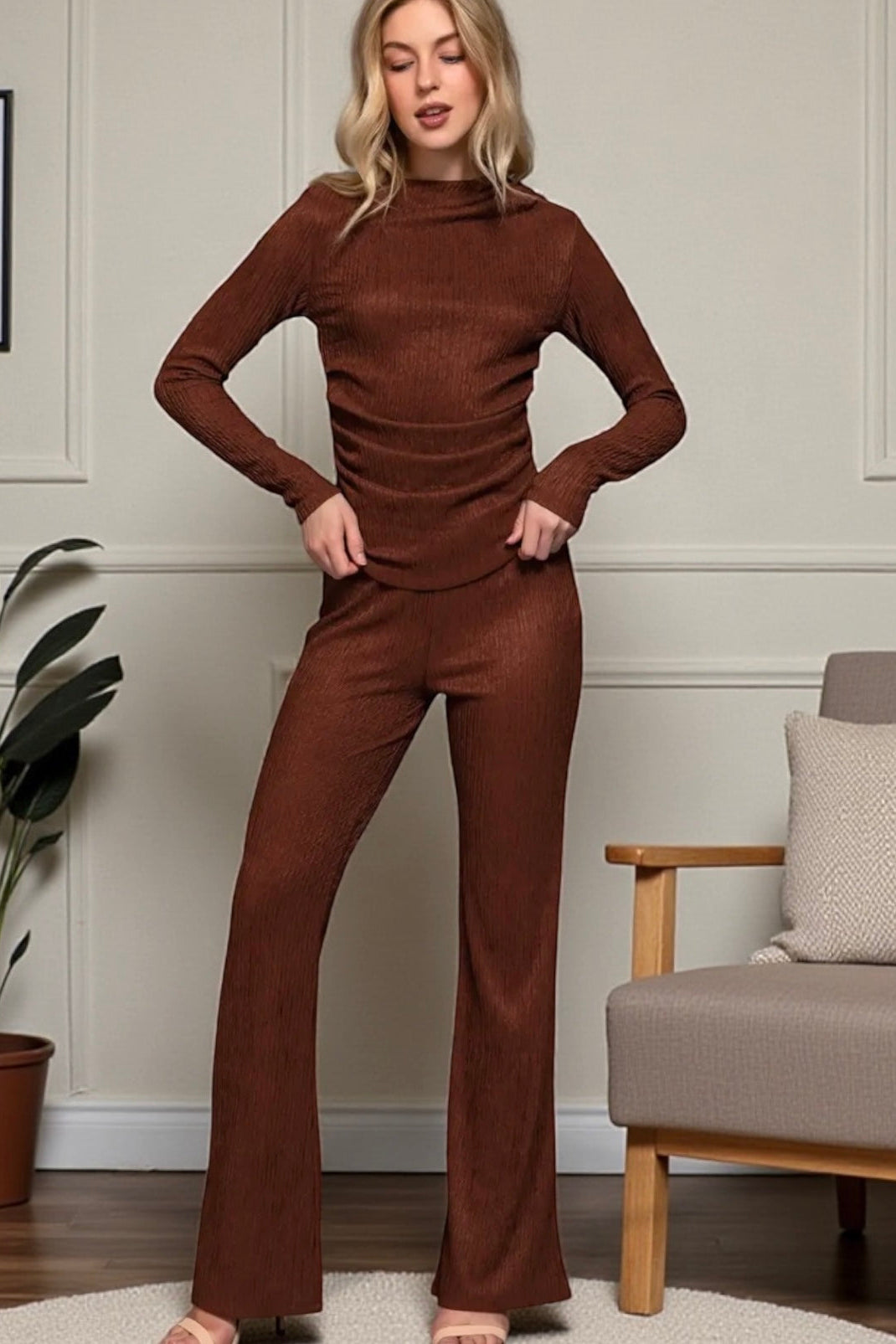 Woman wearing a brown outfit in a living room setting