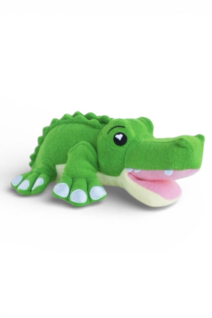 Green plush alligator toy on a white background