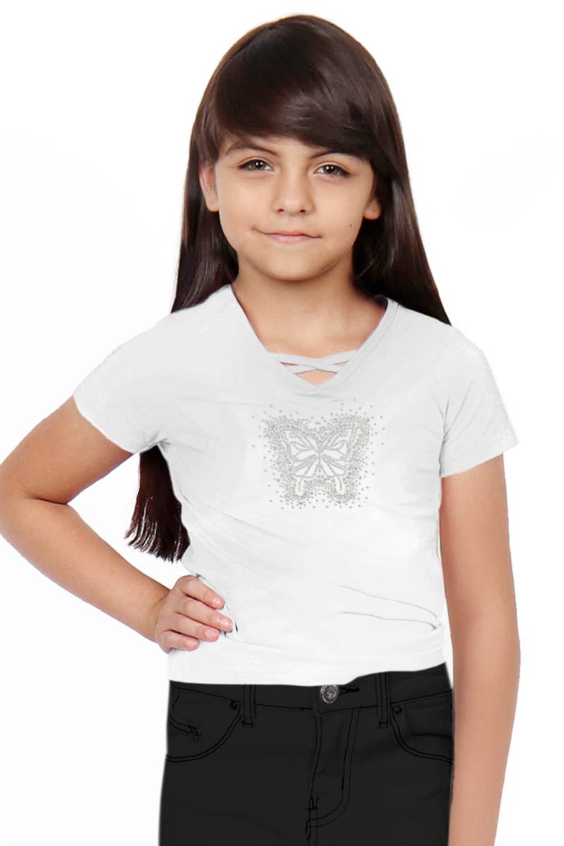 Young girl wearing a white t-shirt with a butterfly design on a plain background