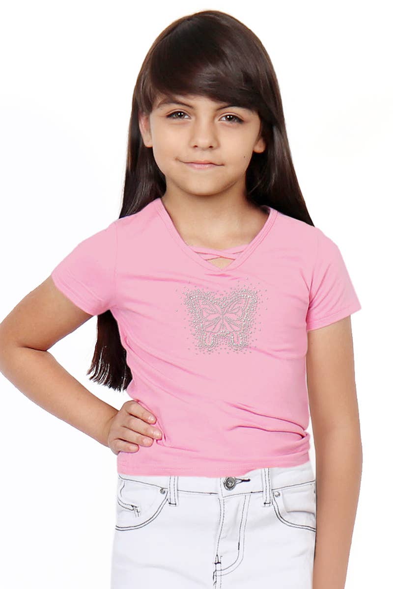 Young girl wearing a pink t-shirt with a butterfly design on a white background