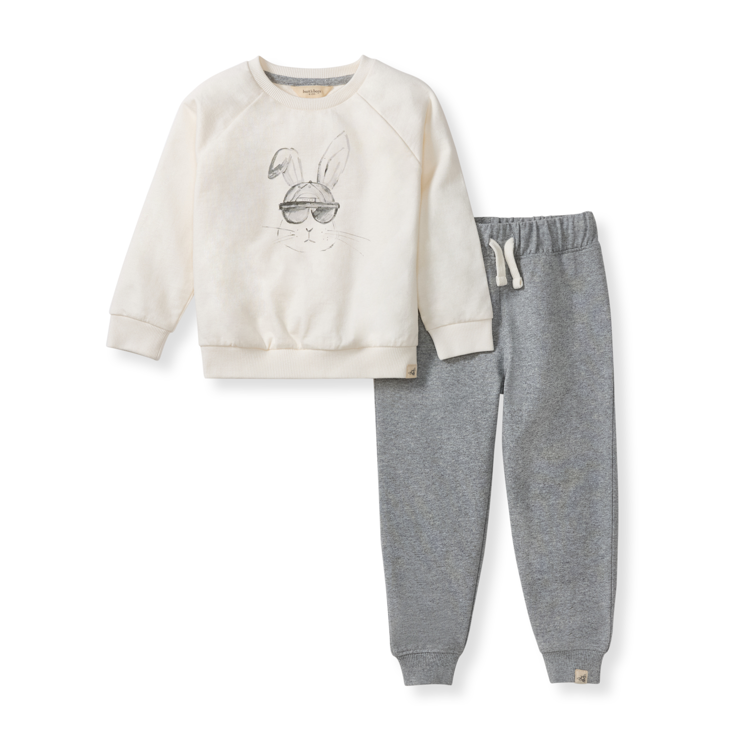 Children's outfit with cream sweatshirt and gray jogger pants on a white background
