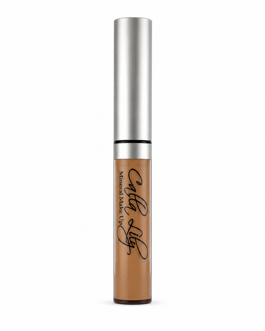 Concealer bottle with silver cap and brown body on a white background