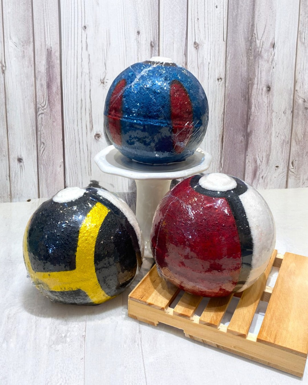 Calla Lily Cosmetics + CL kids handcrafted Poke Ball bath bombs in red, blue, and yellow with mica powder finish
