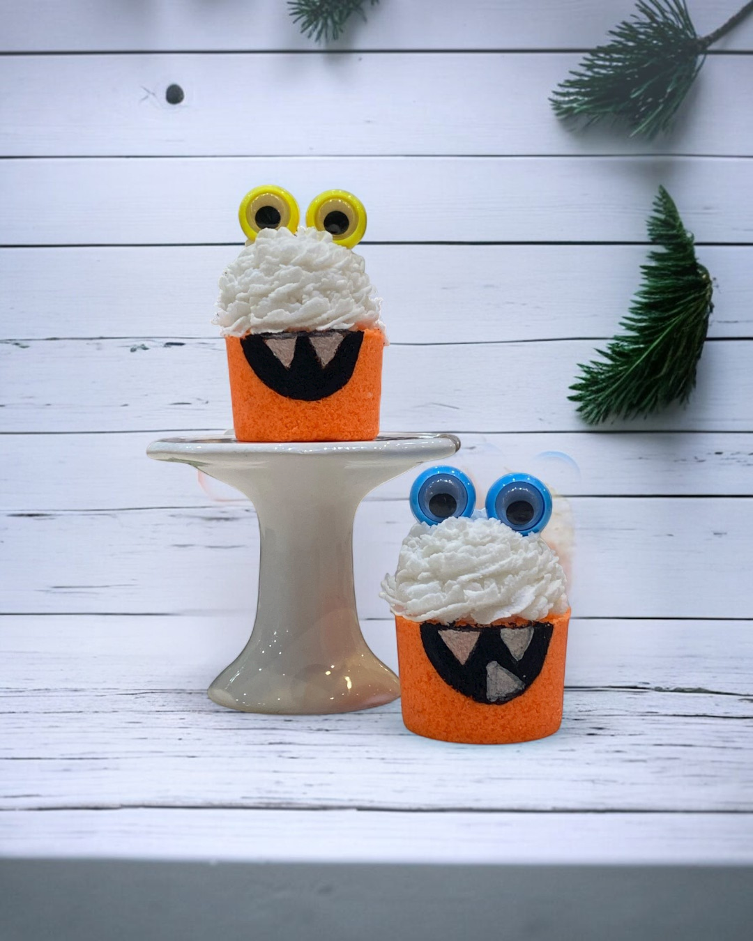 Calla Lily Cosmetics + CL kids orange monster bath bombs shaped like cupcakes with bubble icing and googly eyes.