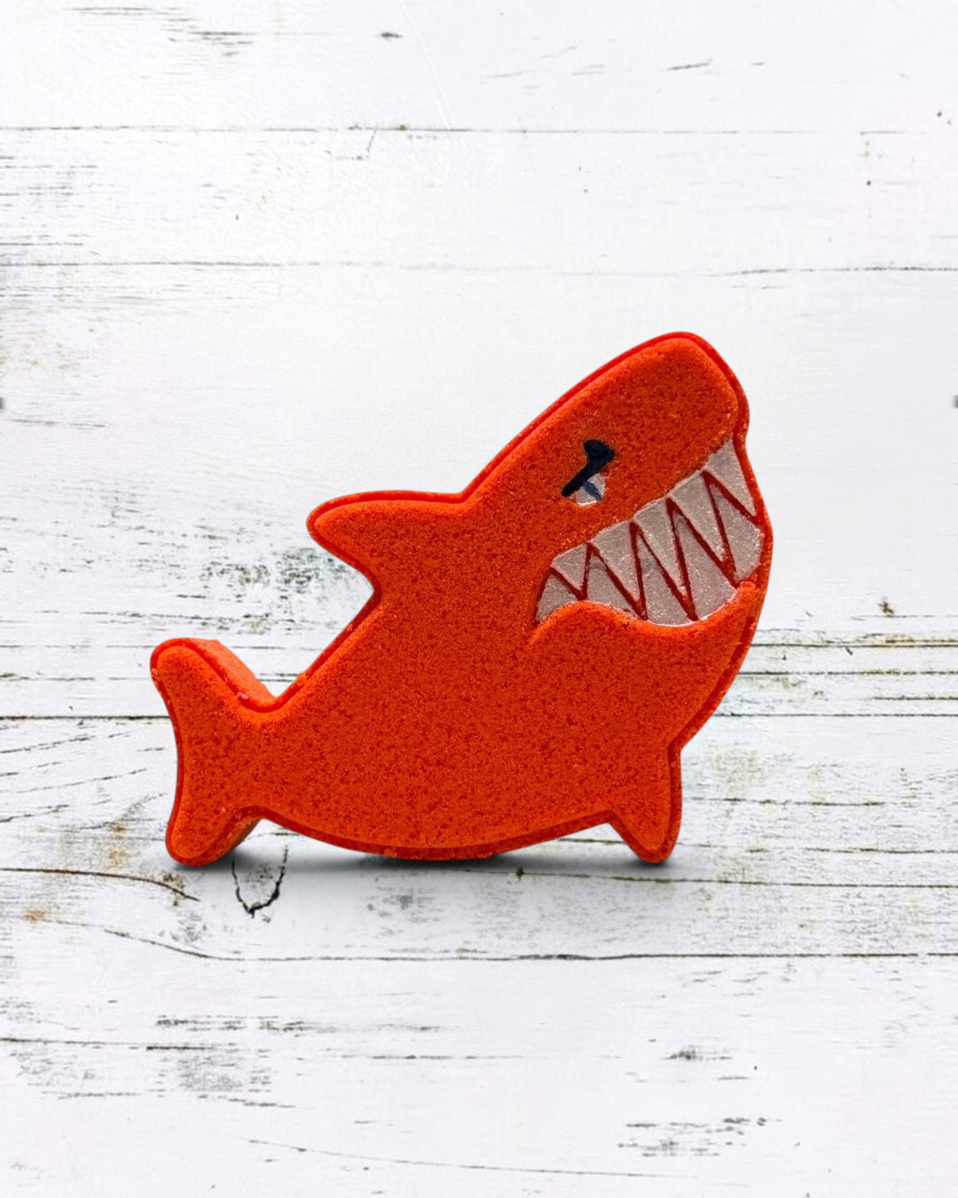 Calla Lily Cosmetics + CL kids red shark-shaped bath bomb with blood orange scent and nourishing cocoa butter
