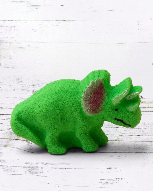 Calla Lily Cosmetics + CL kids green triceratops dinosaur bath bomb with citrus scent on a square ceramic tray