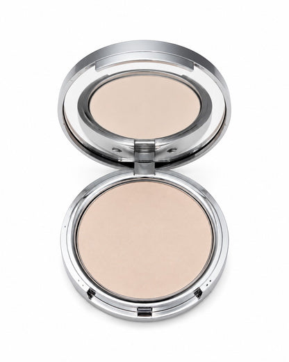 Compact powder in a silver case on a white background