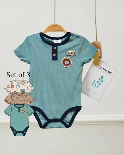 Set of three baby rompers with short sleeves on a white background