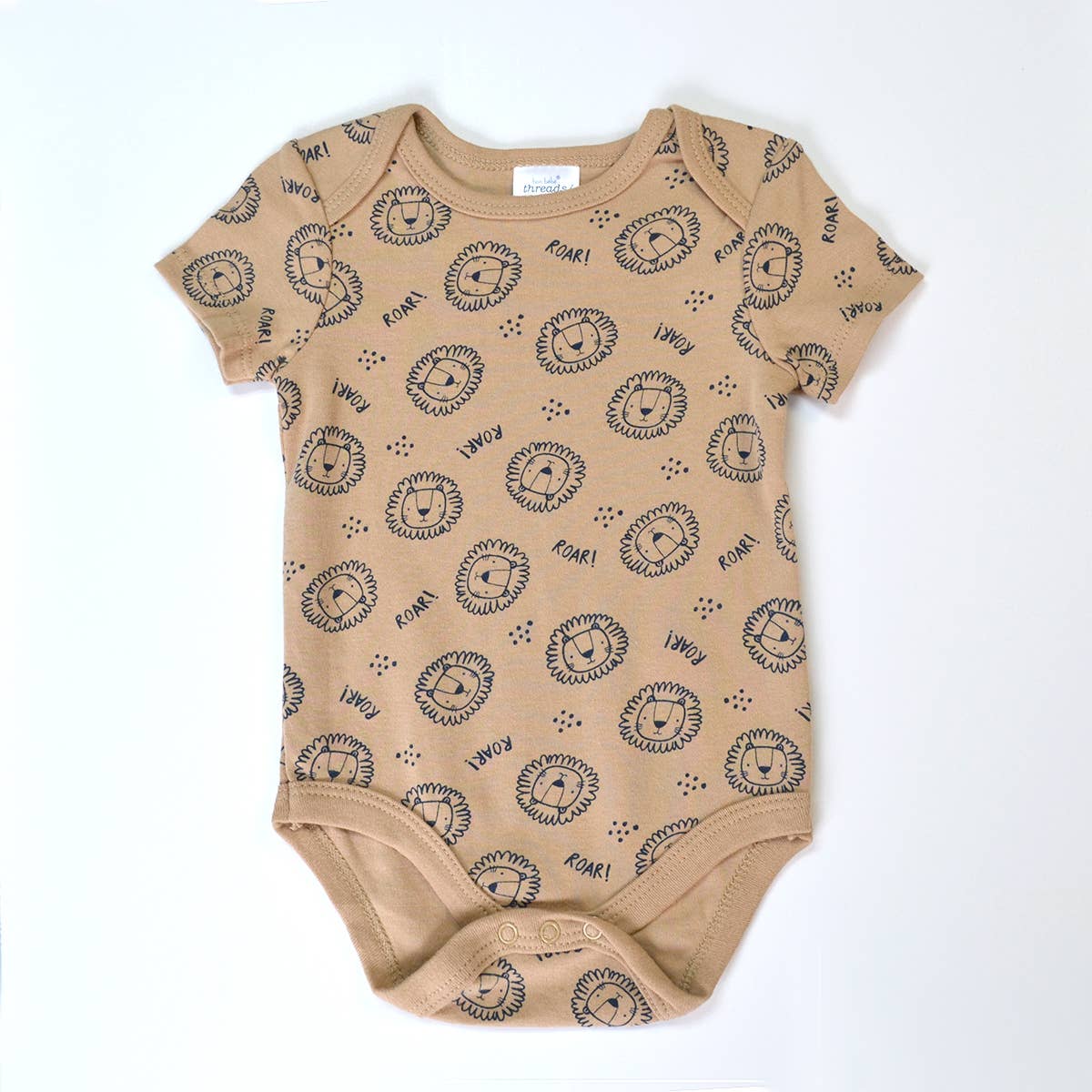 Beige baby onesie with black lion print on a white background