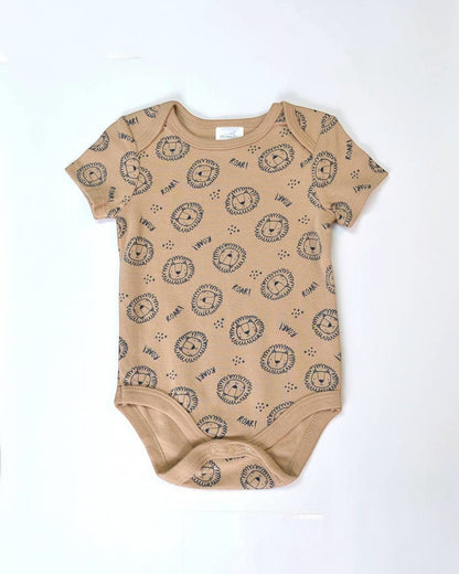Beige baby onesie with black lion print on a white background