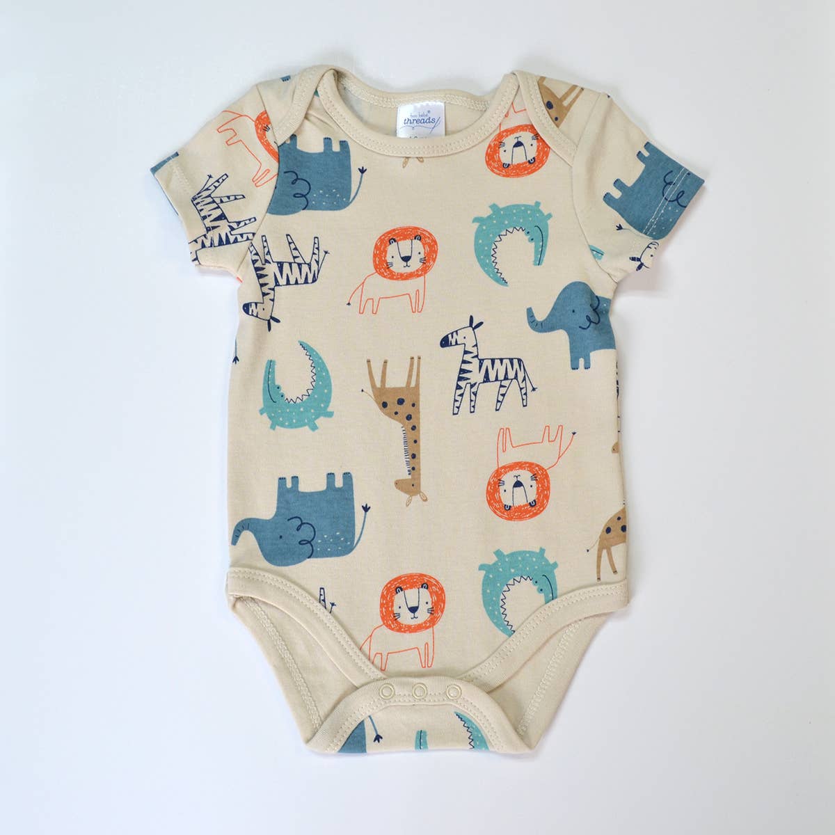 Beige baby onesie with animal patterns on a white background