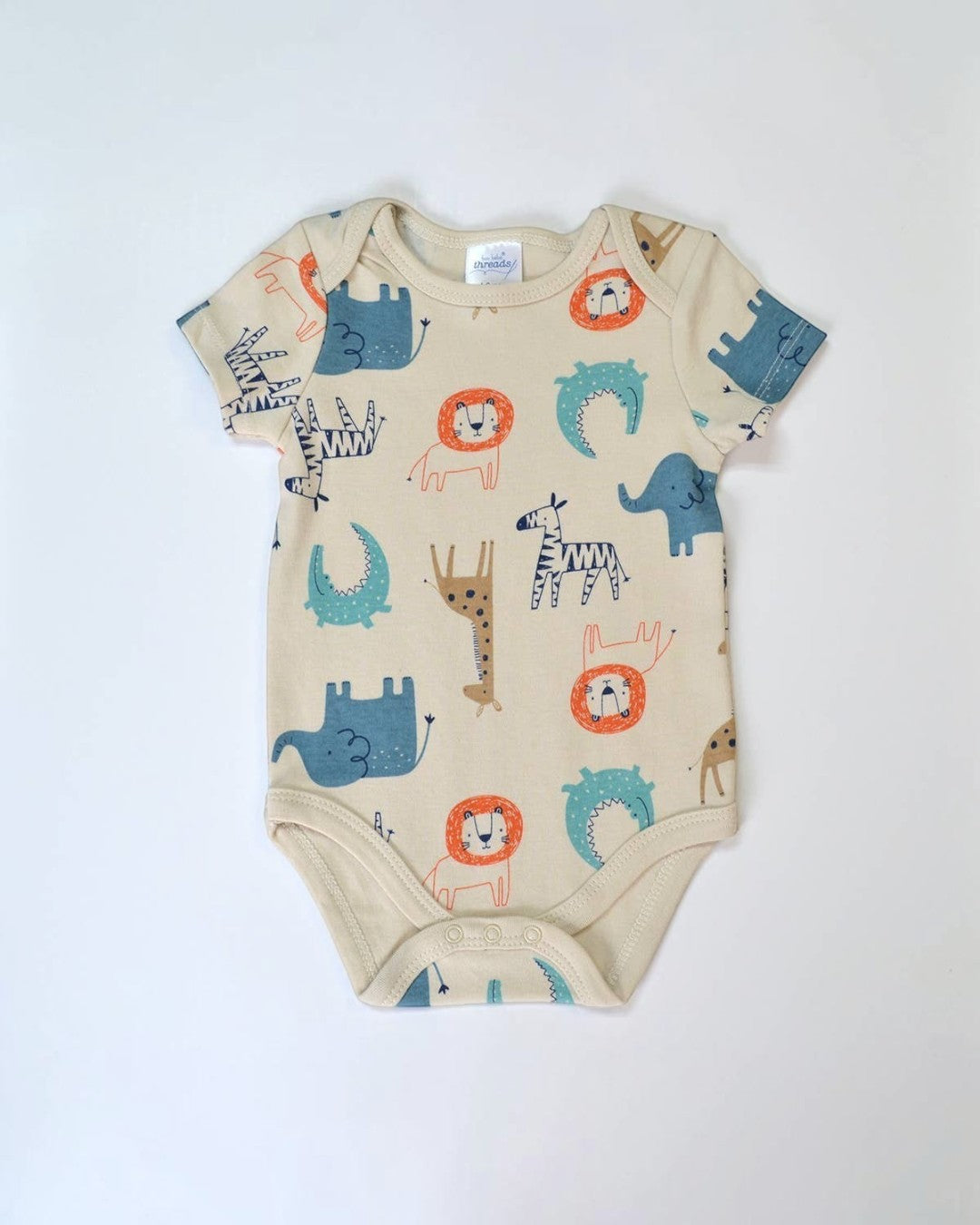 Beige baby onesie with animal patterns on a white background