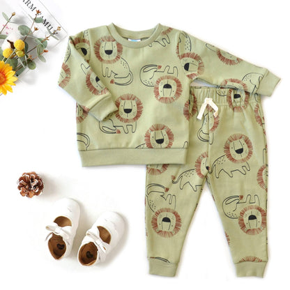 Children's pajama set with lion pattern on a white background