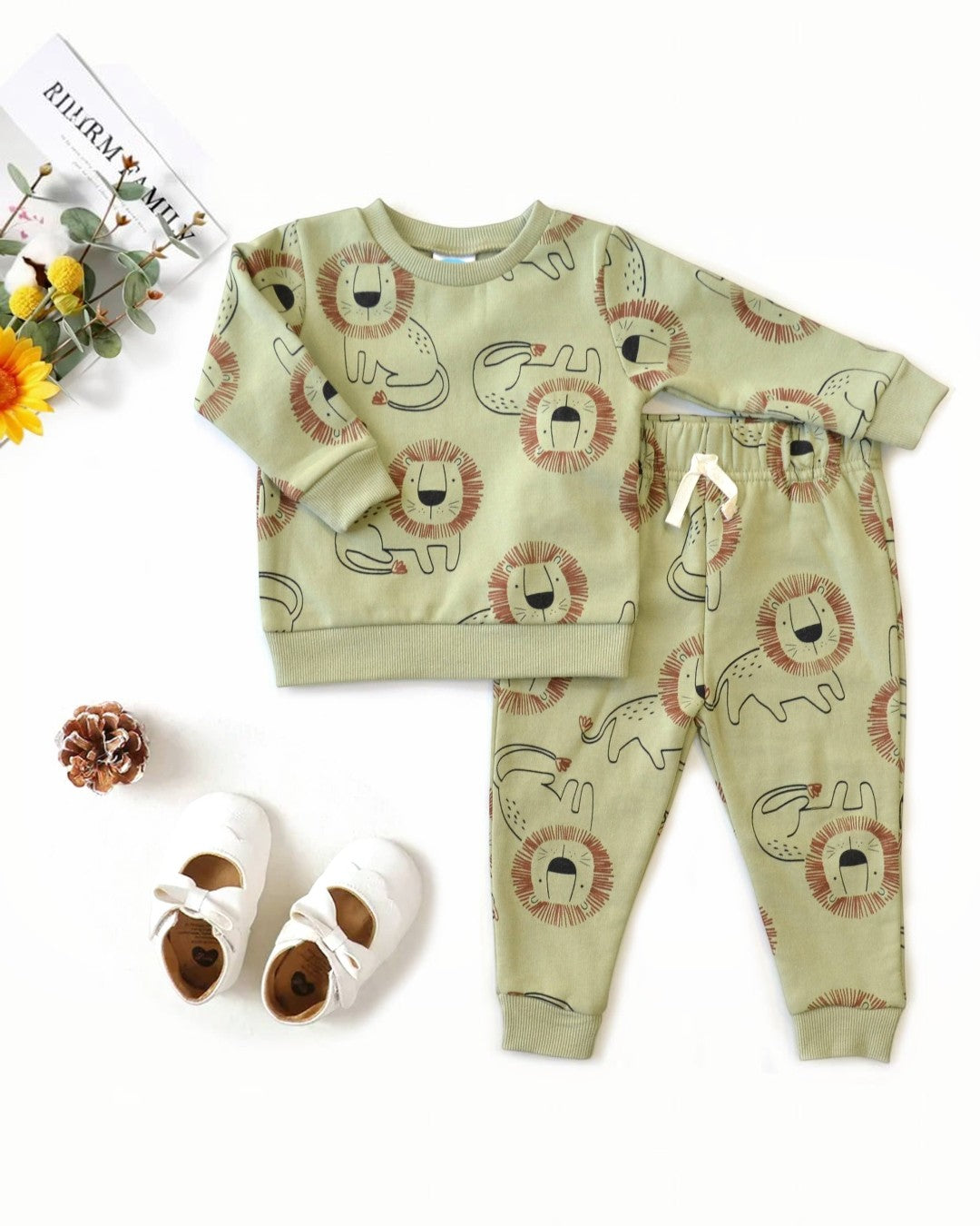 Children's pajama set with lion pattern on a white background