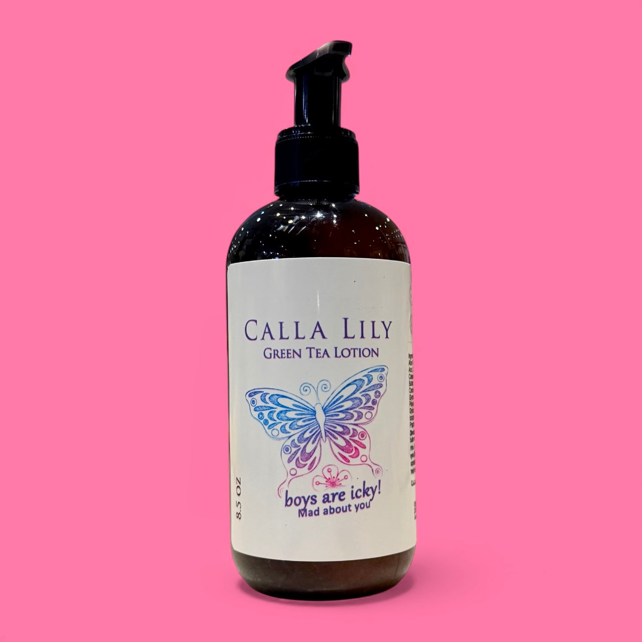 Bottle of Calla Lily Green Tea Lotion with a butterfly design on a pink background Mad About You Cream Lotion