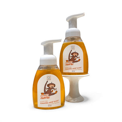 Two bottles of CL Kids Monkey Farts! foaming hand soap on a white background
