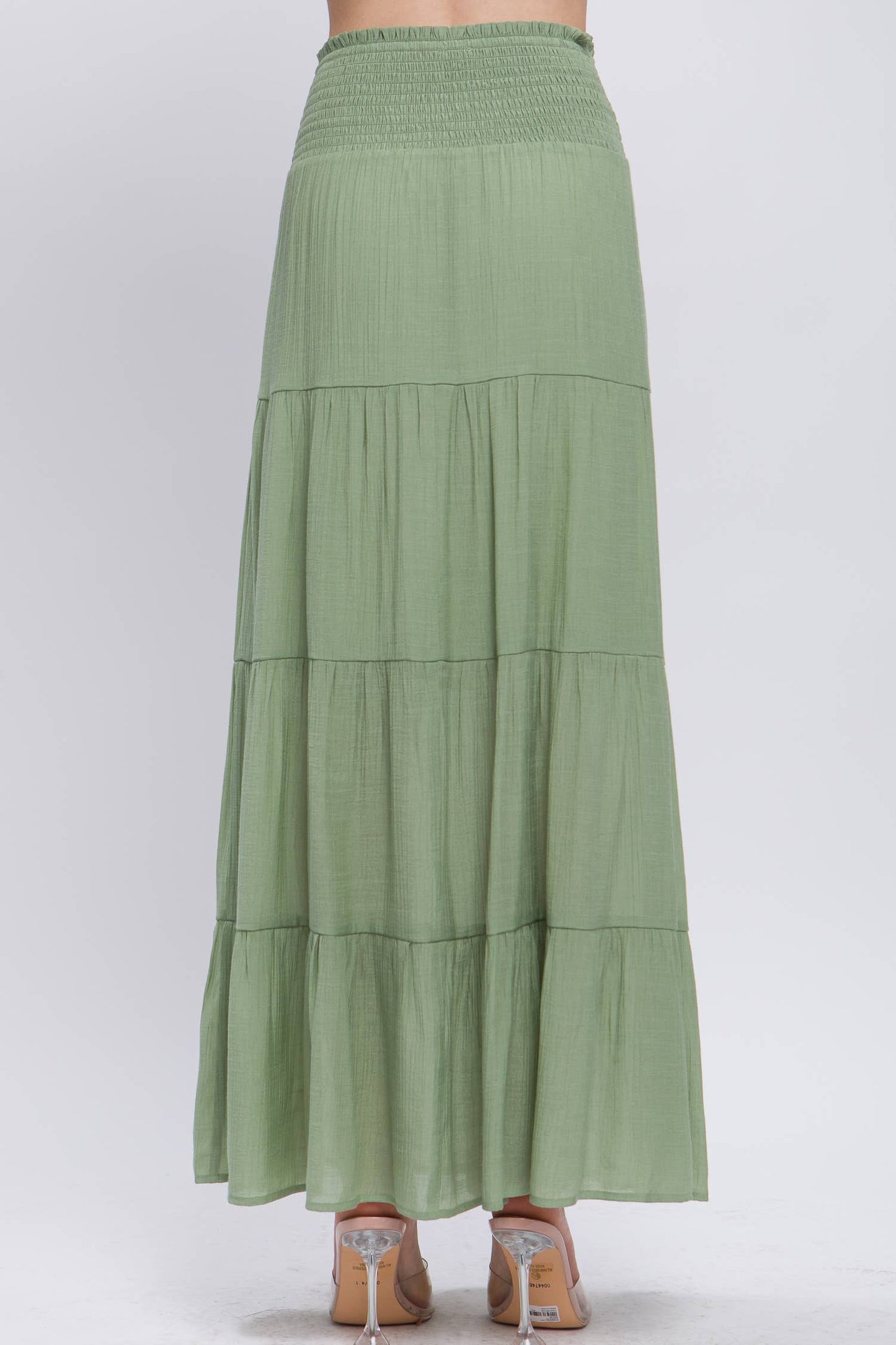 Green tiered skirt on a white background