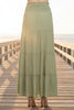 Green tiered skirt on a white background