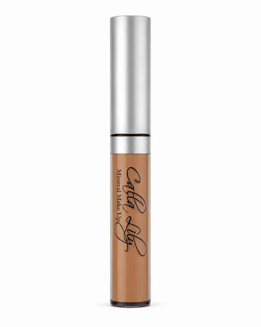 Concealer tube with silver top and brown body on a white background