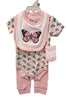 Collection of baby clothing items including a bib, romper, and pants on a white surface.