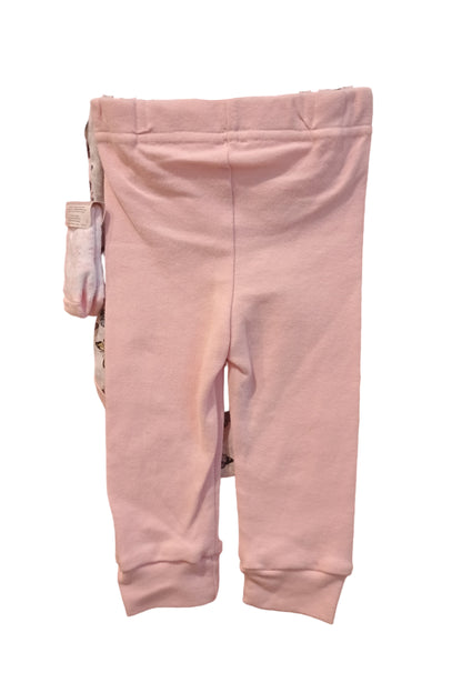 Pink baby pants on a white surface.
