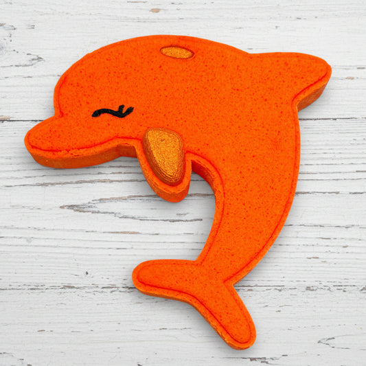 Orange dolphin-shaped object on a white background