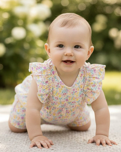 Calla Lily Cosmetics + CL kids pastel floral print organic cotton baby girls' romper with ruffle sleeves.