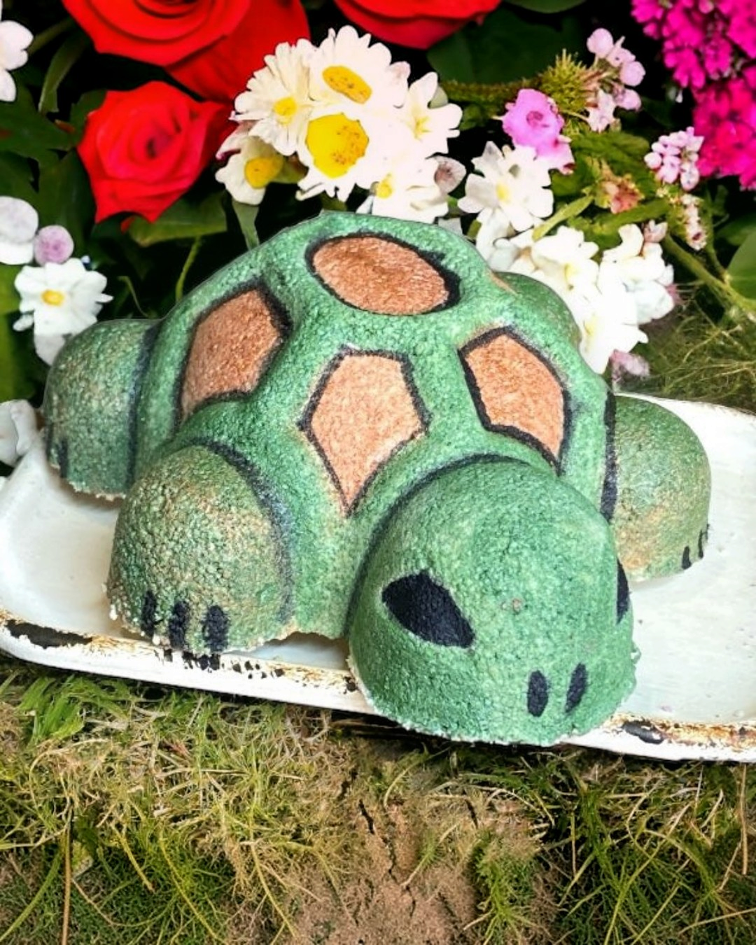 Calla Lily Cosmetics + CL kids turtle-shaped bath bomb in green and brown, crafted with cocoa butter and coconut oil.