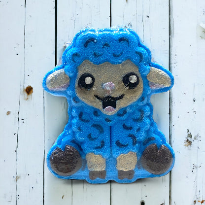 Blue sheep-shaped patch on a white wooden background