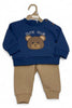Children's navy blue sweatshirt with bear design and brown pants on a hanger.