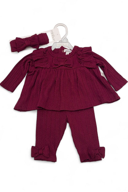 Maroon baby outfit with top, leggings, and headband on a white background