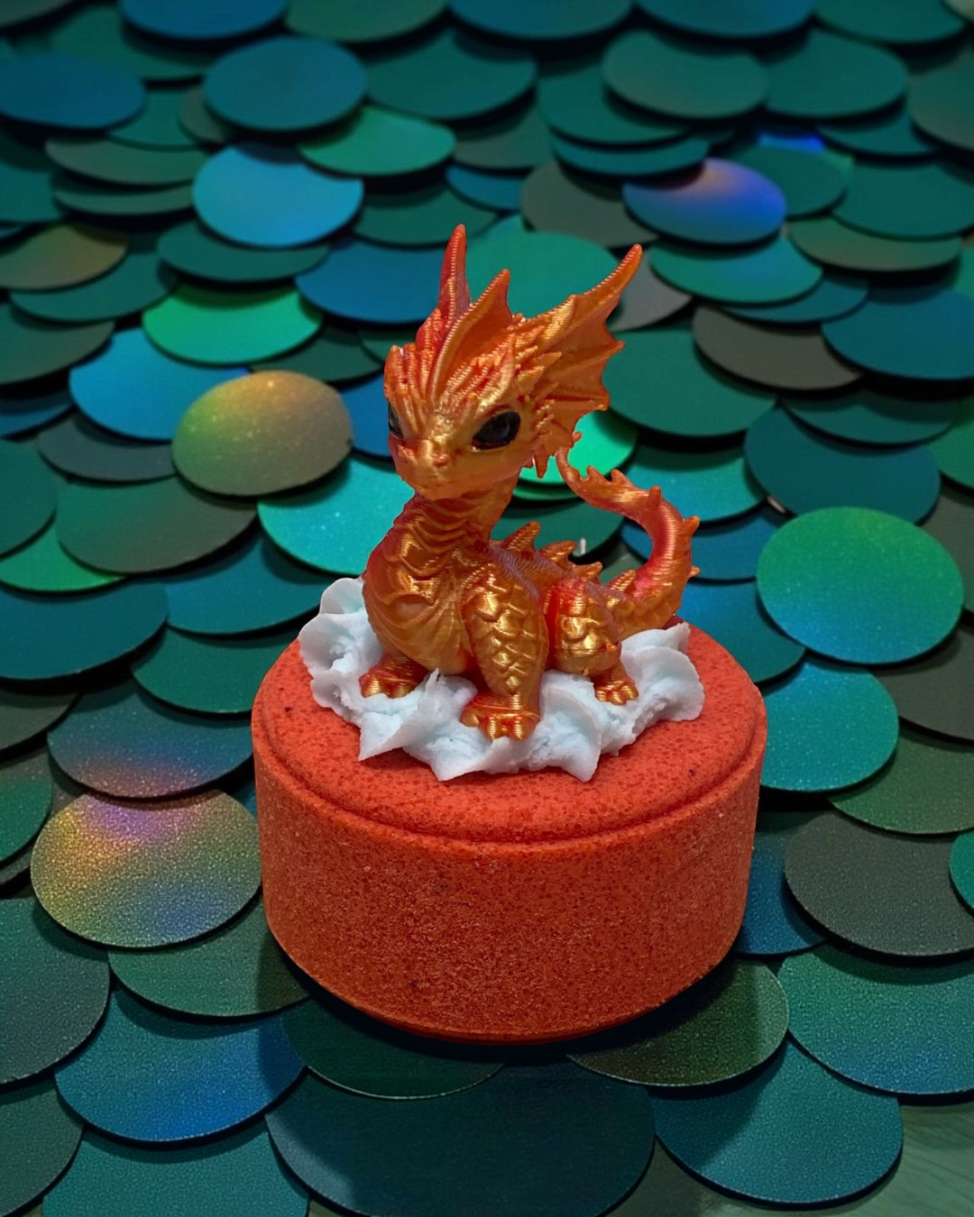 Calla Lily Cosmetics + CL kids Fire Dragon bath bomb with a 3D printed orange dragon toy on a blood orange scented base