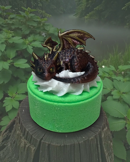 Calla Lily Cosmetics + CL kids Earth Dragon bath bomb with a 3D printed brown dragon toy on a bright green base