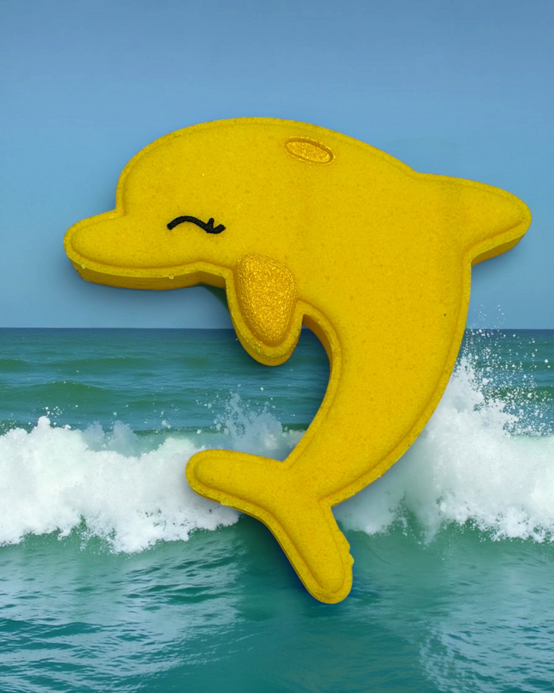 Calla Lily Cosmetics + CL kids yellow dolphin shaped bath bomb with pineapple scent and nourishing cocoa butter
