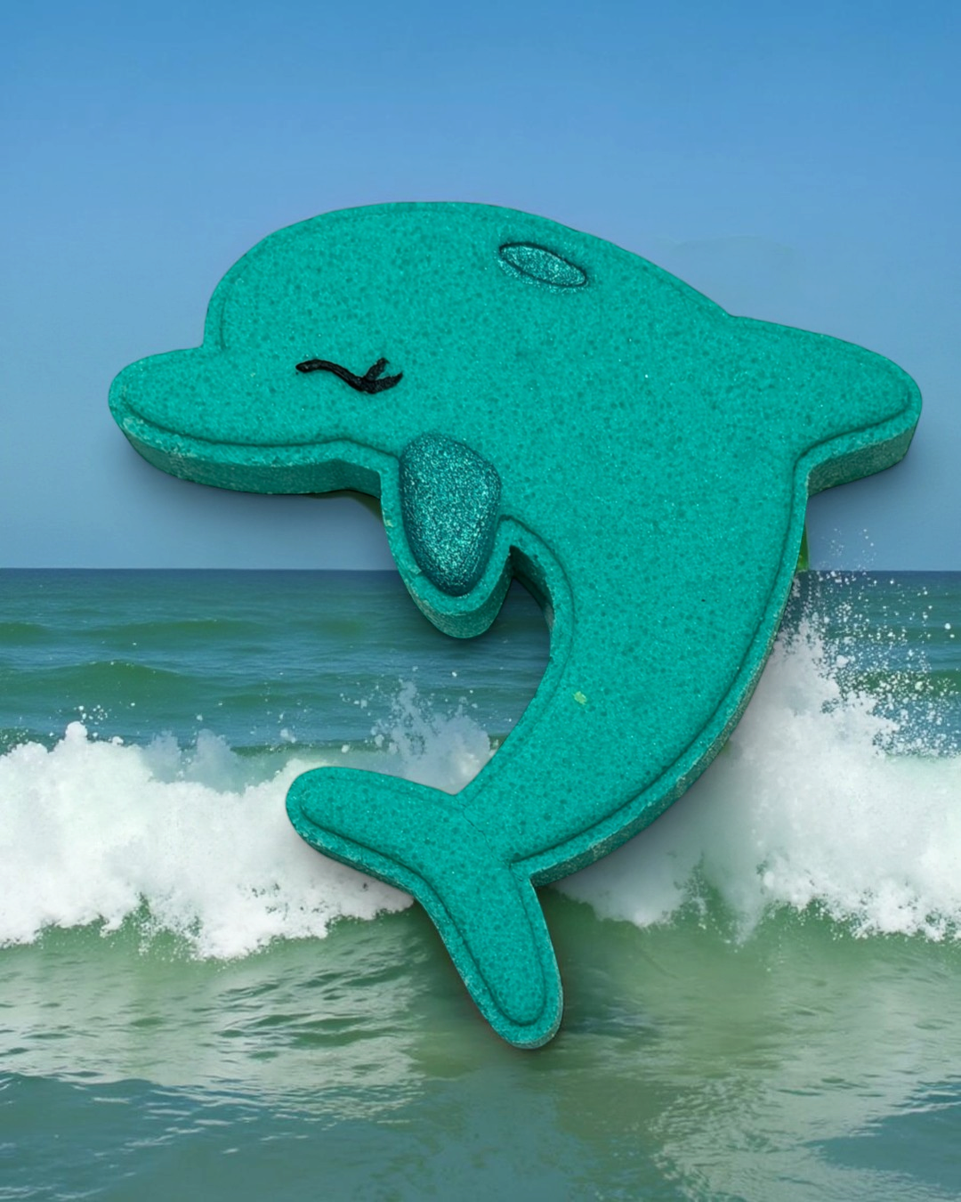 Calla Lily Cosmetics + CL kids teal dolphin-shaped bath bomb with floral scent and nourishing cocoa butter