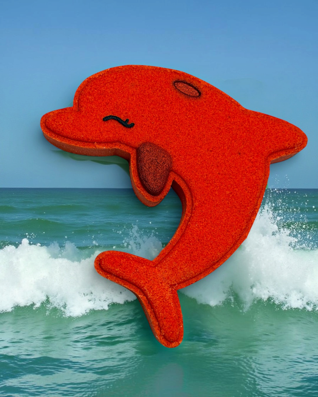 Calla Lily Cosmetics + CL kids dolphin-shaped red bath bomb with blood orange scent for sensitive skin
