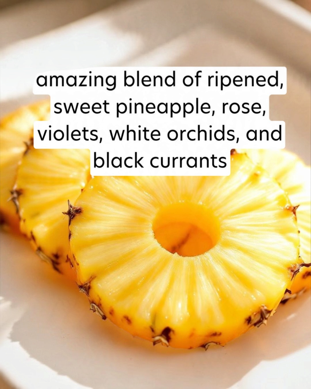 Sliced pineapple on a white plate with descriptive text overlay.