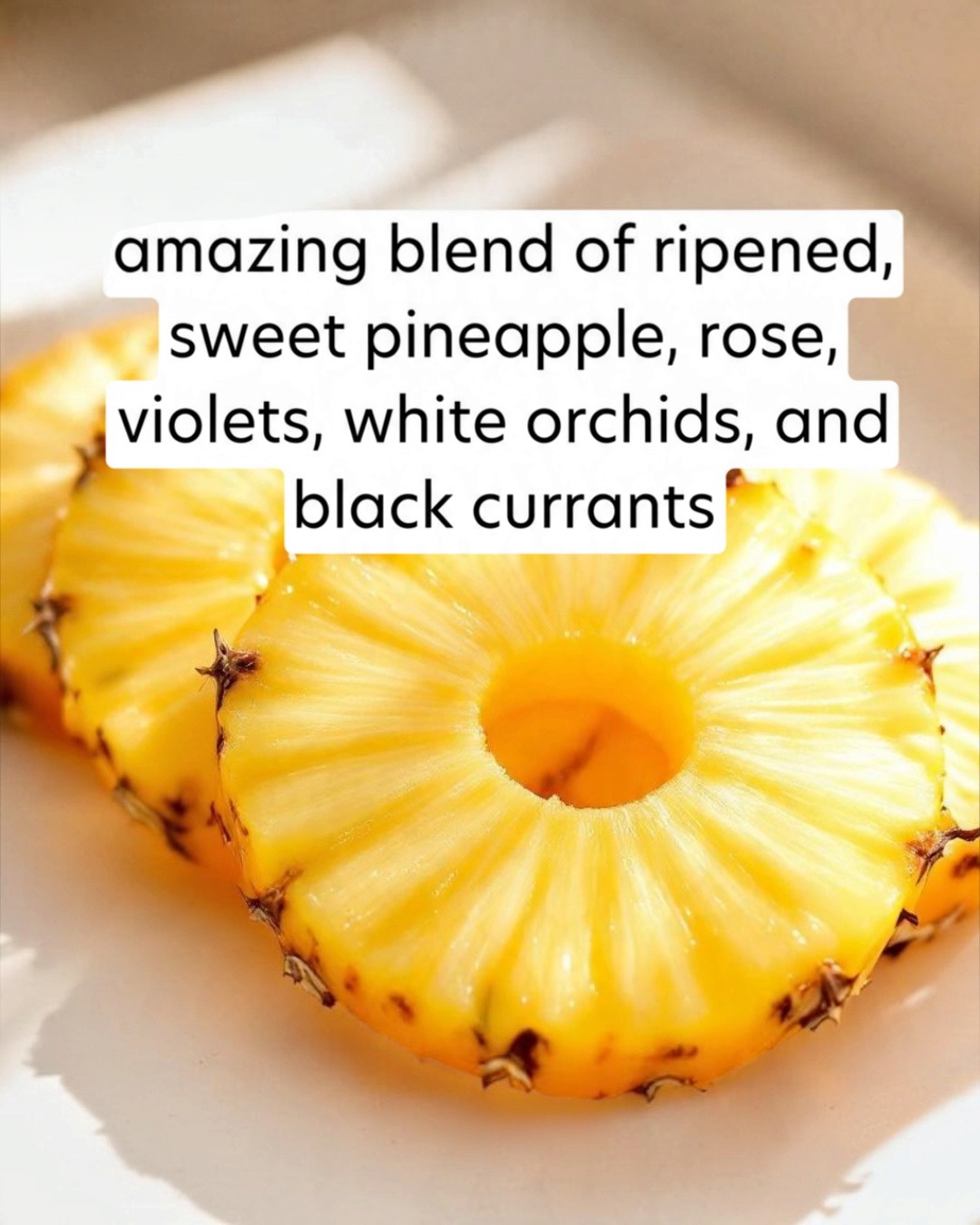 Sliced pineapple on a white plate with descriptive text overlay.