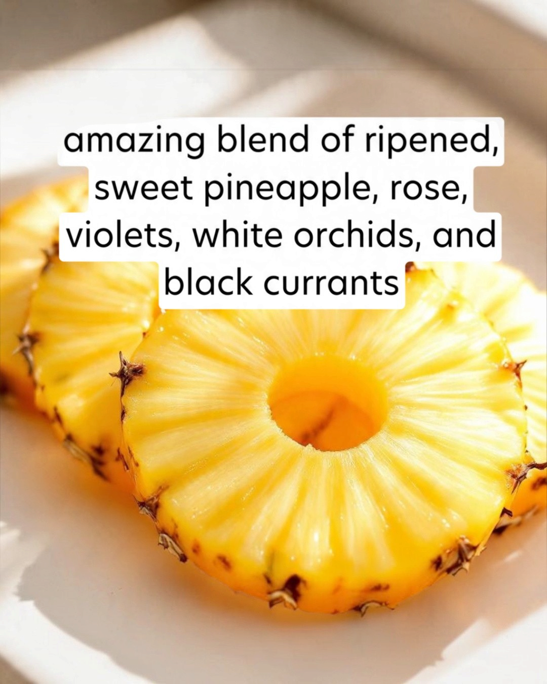 Sliced pineapple on a white plate with descriptive text overlay.
