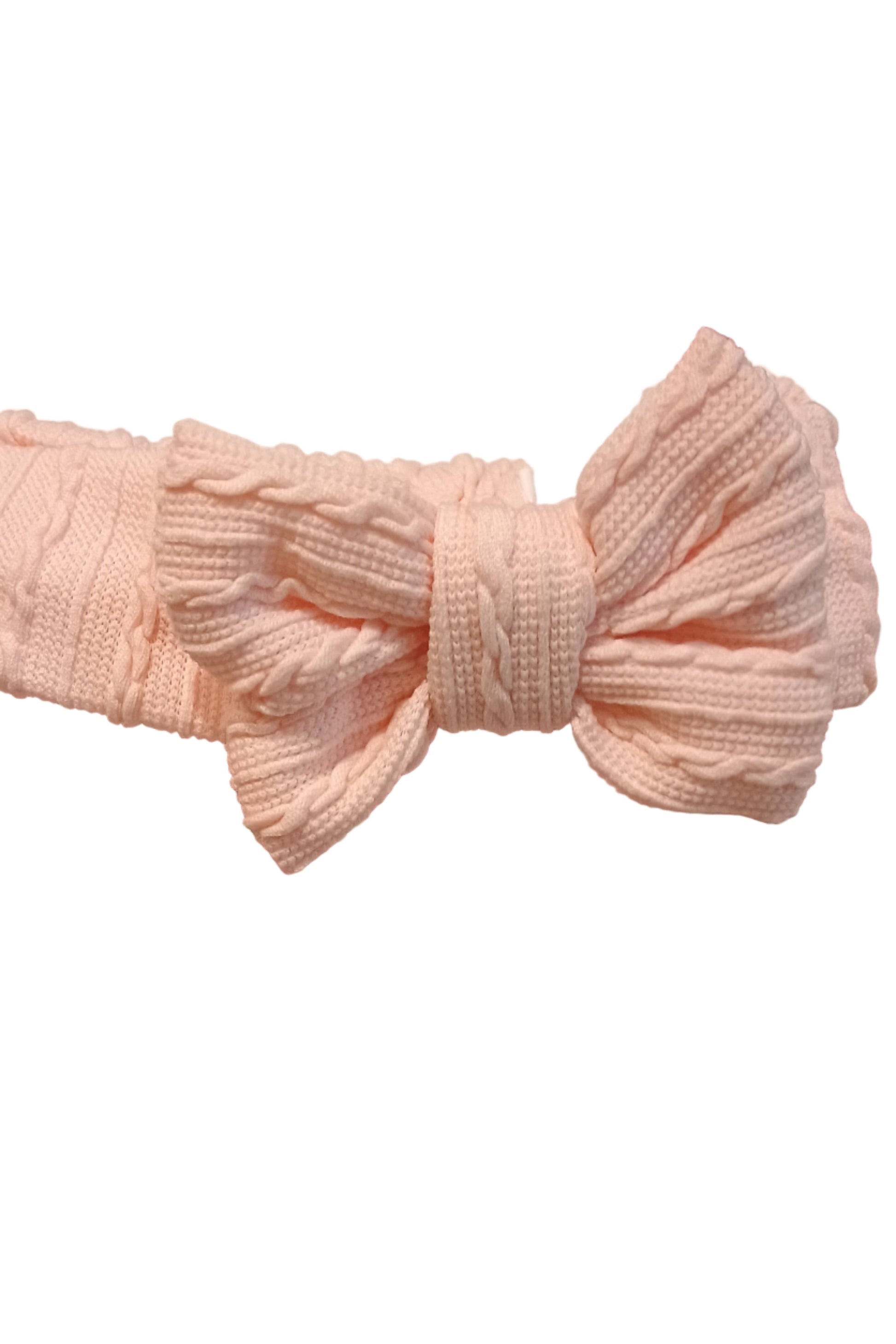 Pink textured headband with a bow on a white background