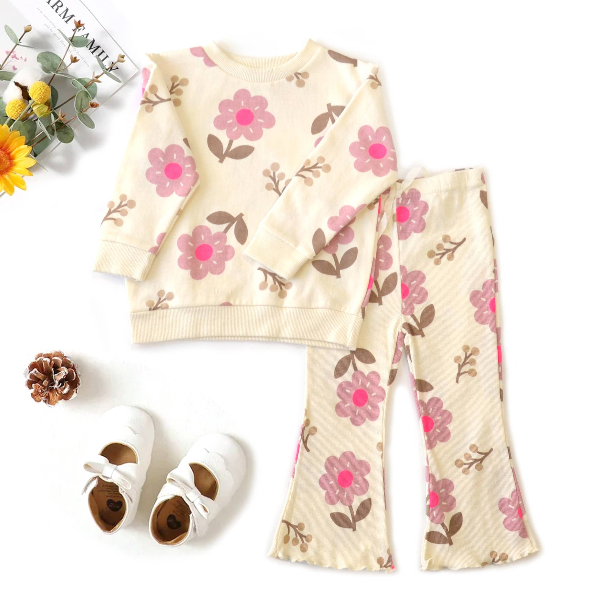 Children's floral outfit with matching shoes on a white background