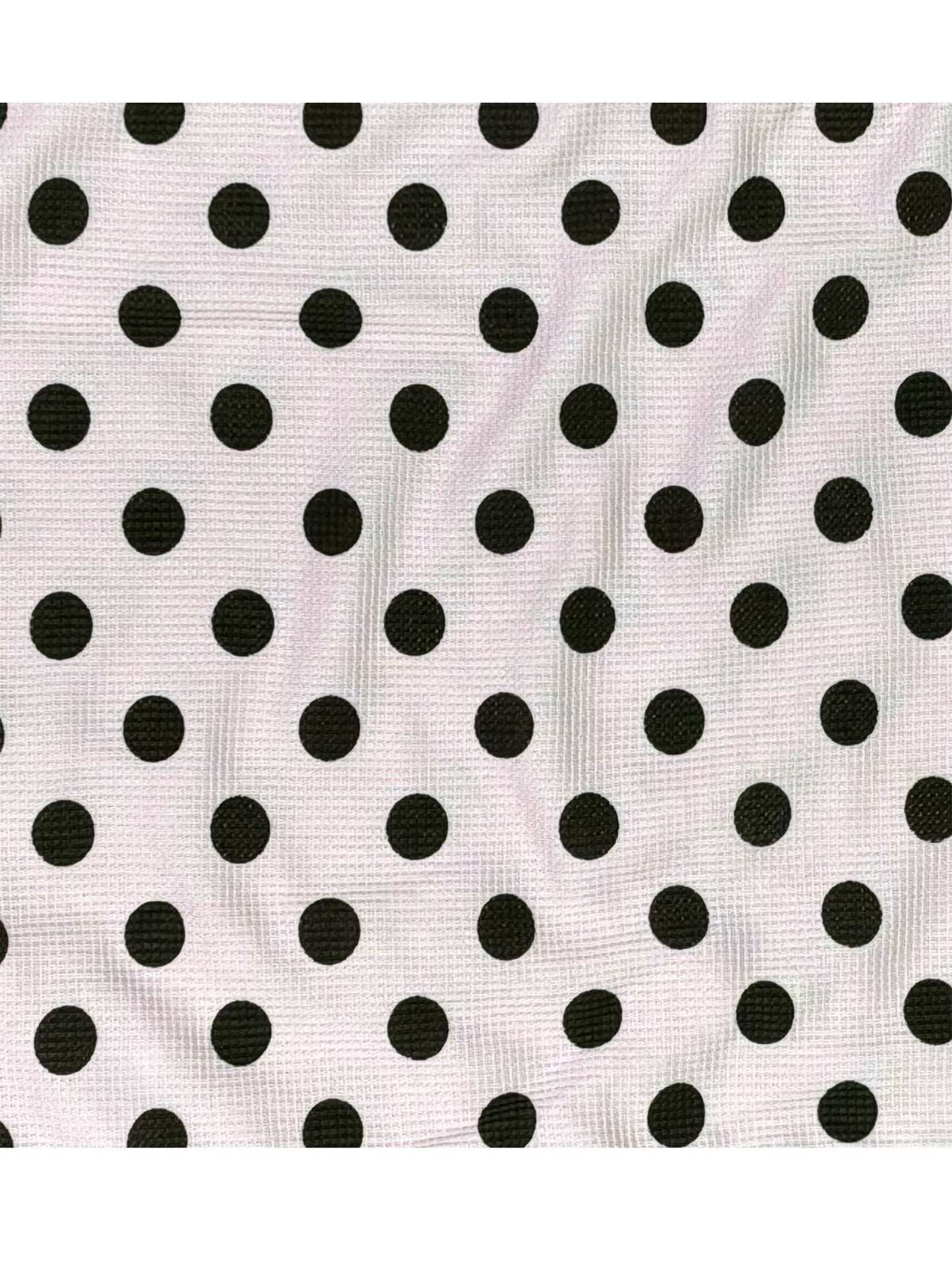 Black polka dots on a white background