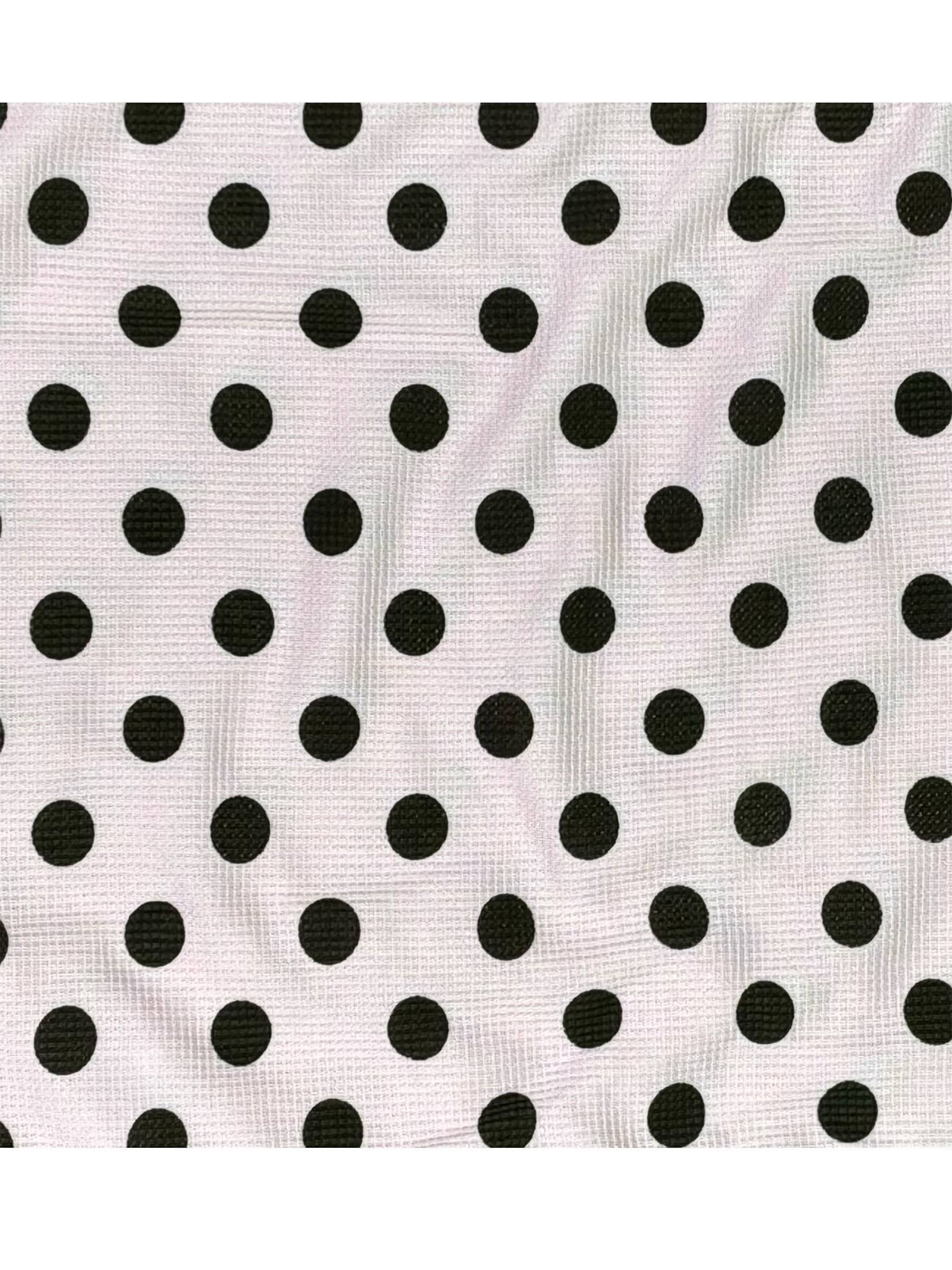 Black polka dots on a white background