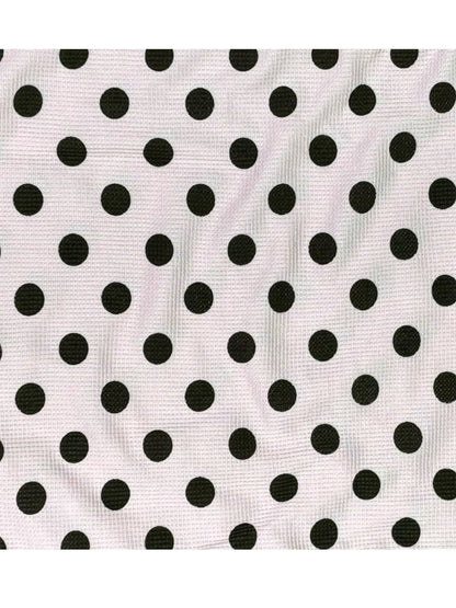 Black polka dots on a white background