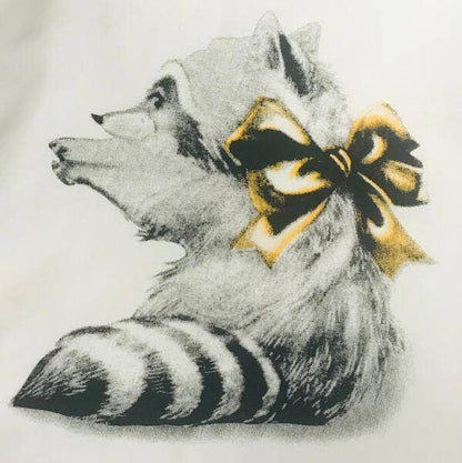 Raccoon illustration with a yellow bow on a light gray background