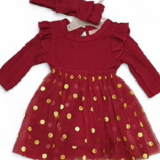 Red dress with gold polka dots and matching headband on a white background