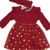 Red dress with gold polka dots and matching headband on a white background