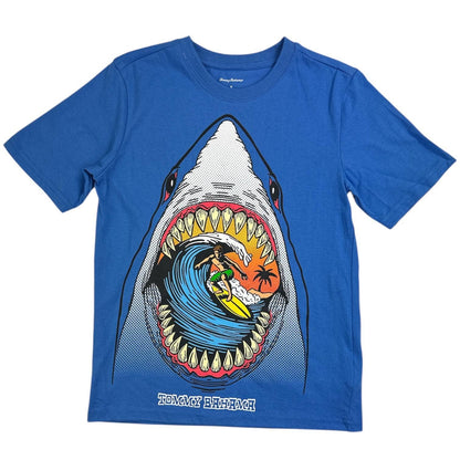 Blue t-shirt with a shark graphic featuring a surfer, on a white background
